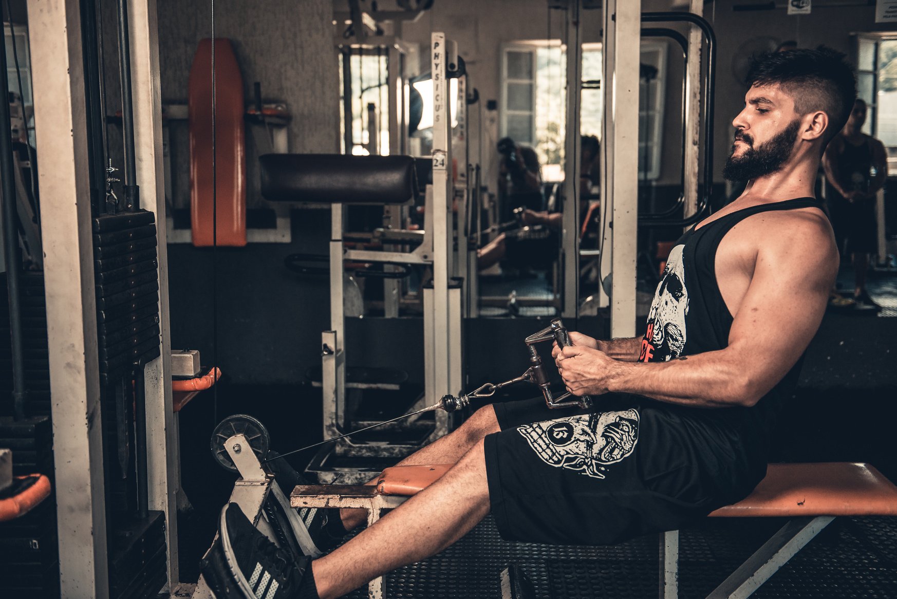 Man in Black Tank Top Exercising